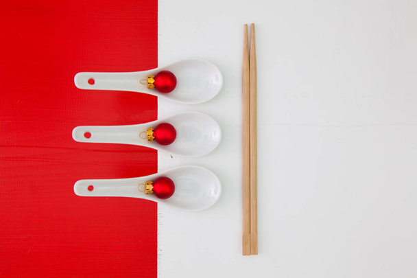 Ceramic spoons and bamboo chopsticks for sushi food  - Photo, Image