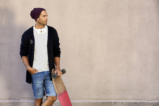 Young man with skateboard - Photo, Image