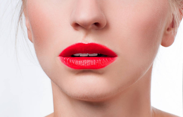 Beautiful female lips with red lipstick - 写真・画像