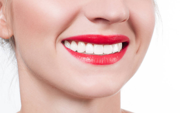 White teeth and red lips.  Perfect female smile after whitening teeth. - Foto, Imagem