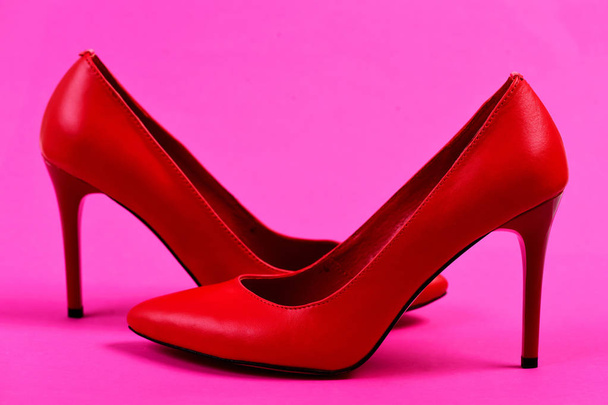 Womens accessories on pink background: high heel formal shoes - 写真・画像