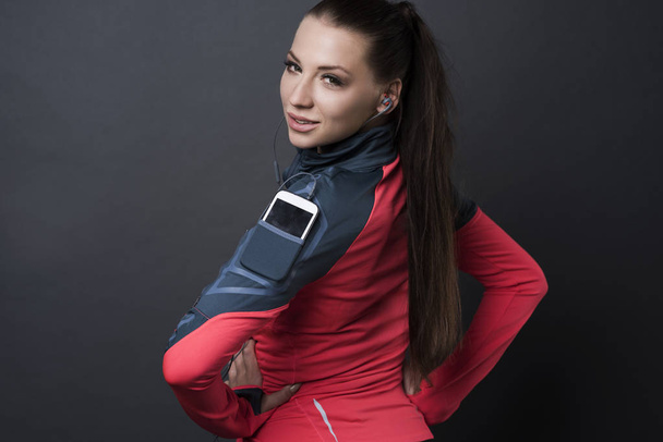 sportive woman with smartphone  - Photo, Image