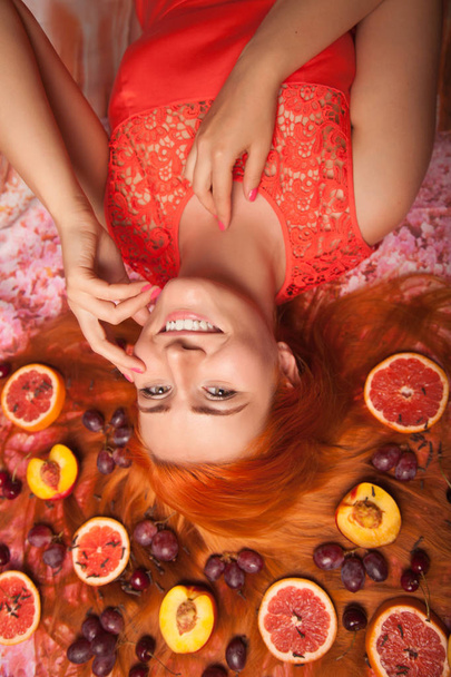 pretty happy healthy young girl with fruits top view - Фото, изображение