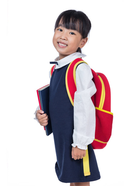 Asian Little Chinese girl in school uniform with school bag - Фото, изображение