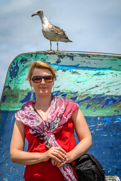 Portrait of a woman with a seagull - Photo, Image