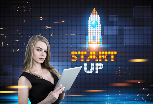 Blonde woman with a tablet, start up rocket - Фото, изображение