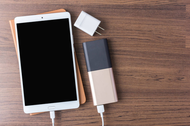 charger cables connect with smartphone and tablet - Φωτογραφία, εικόνα