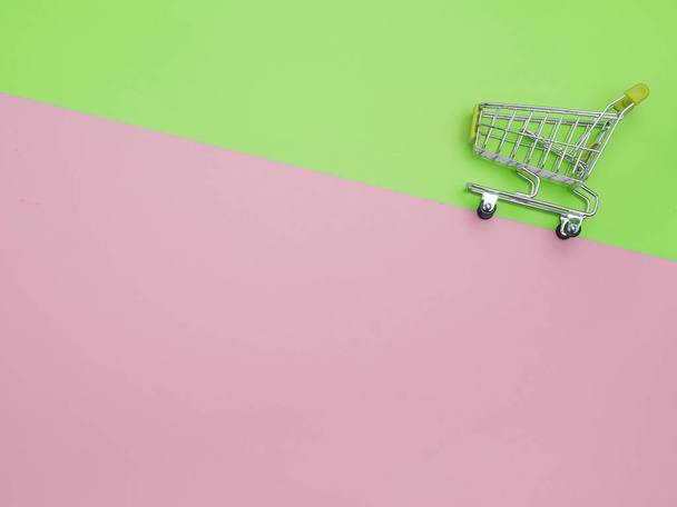 Collection of shopping cart  full of shopping time.Top view or flat lay composition cart on color background. - Foto, Imagem