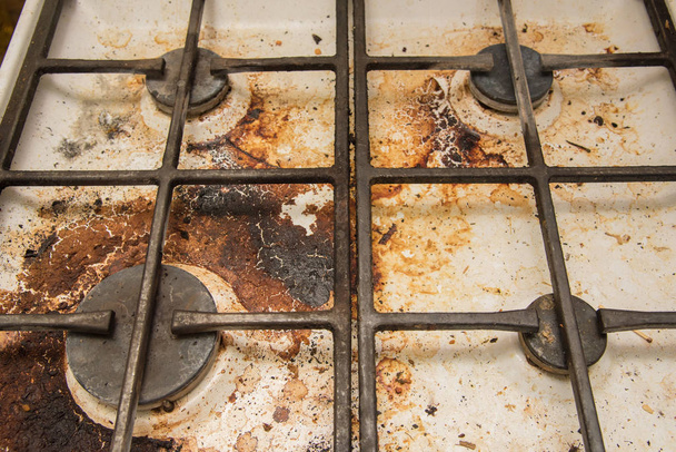 Gas fornuis platen gekleurd tijdens het koken - Foto, afbeelding
