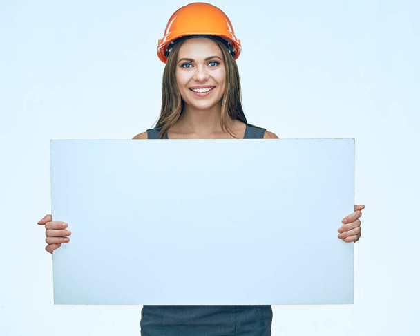 Smiling Business woman builder  presenting white adertising bann - Photo, Image