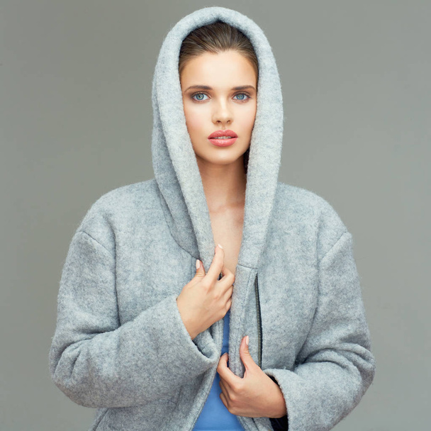 woman wearing gray coat with big hood - Фото, изображение
