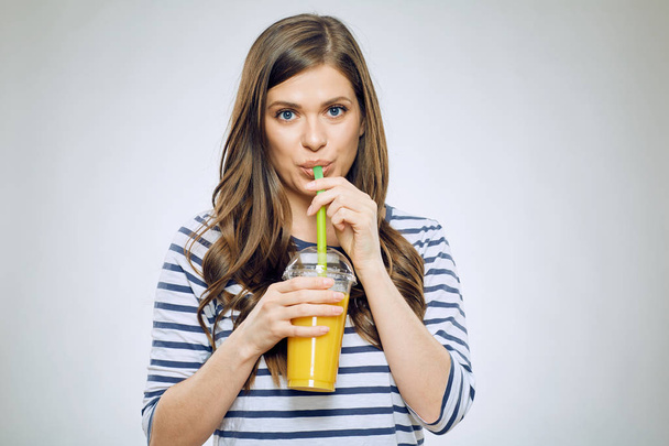 Woman drinking orange juice  - Фото, зображення