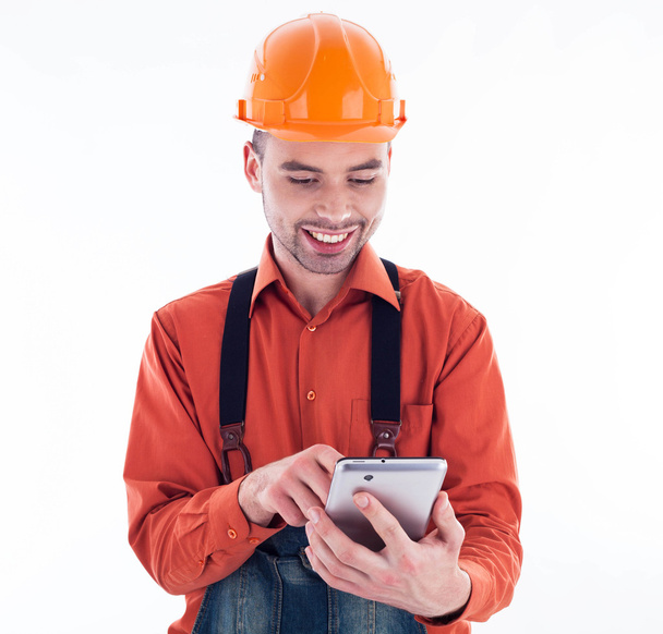 A builder with a tablet - Fotó, kép