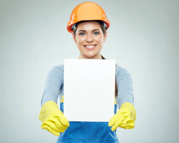 woman builder holding white banner - Photo, Image