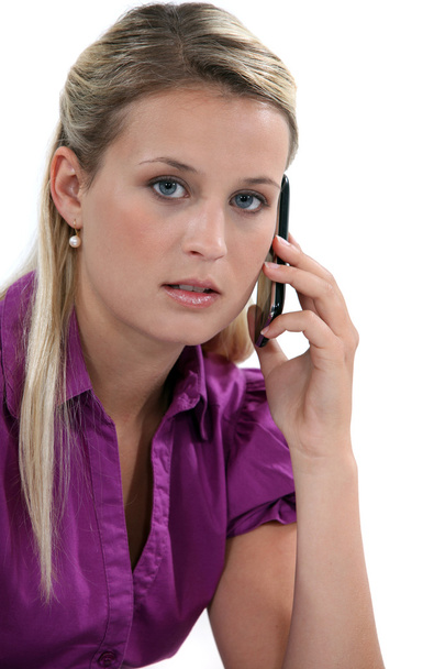 Blond woman with mobile telephone - Foto, afbeelding