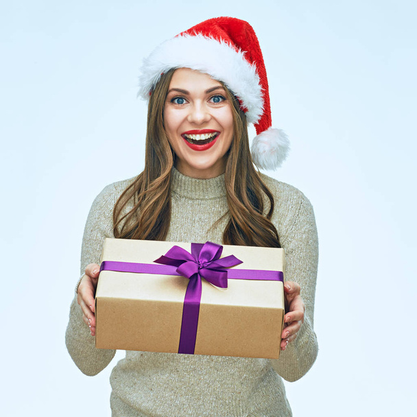 Smiling Santa girl holding gift box.  - Fotó, kép