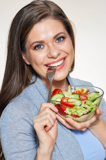Woman eating salad. Close up face portrait.  - Foto, Imagem