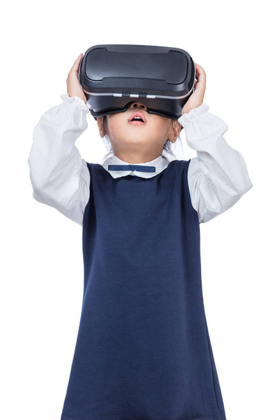 Asian little Chinese girl experiencing virtual reality via VR go - Photo, image