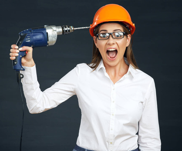 Funny businesswoman builder in helmet  - Fotoğraf, Görsel