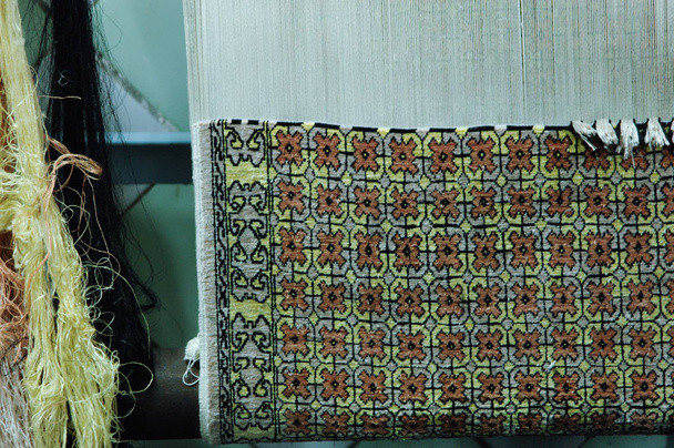 producción y tejido de alfombras y tejidos
 - Foto, imagen