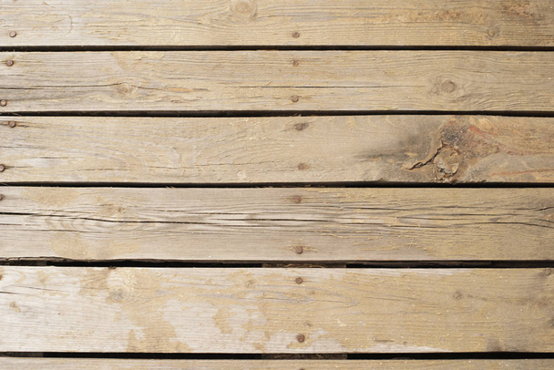 Real wooden floor put together with nails. The way we touch nature easily. Old wood background, texture - Photo, Image