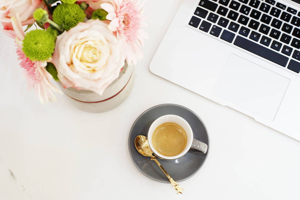 Feminine workplace concept in flat lay style with laptop, coffee - Foto, Bild