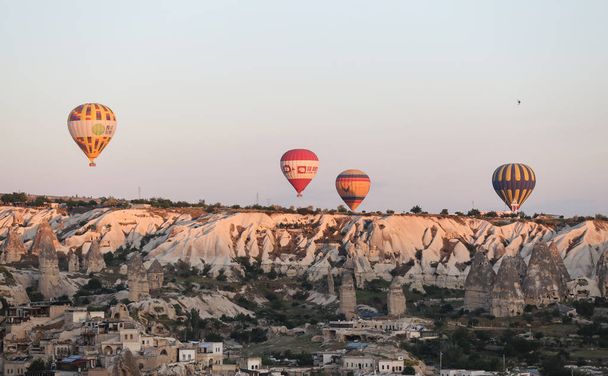 Hot Air Balloons Over Goreme Town - Photo, Image