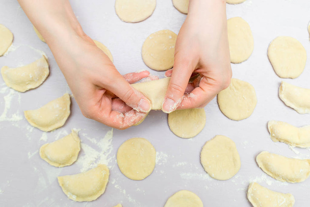 Womans hands make ravioli - Foto, immagini