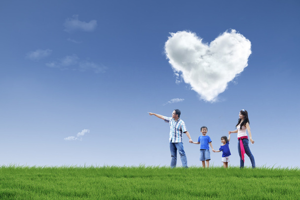 Happy family and cloud of love in park - Fotoğraf, Görsel