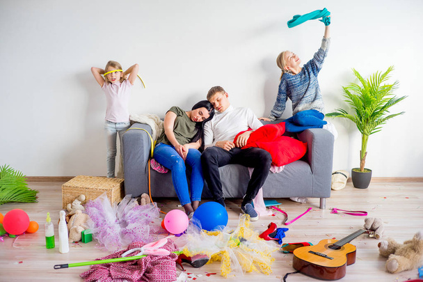 Parents sleeping in a middle of a mess - Foto, immagini