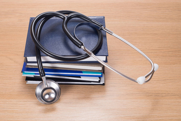 Stethoscope on pile of planners - Photo, Image