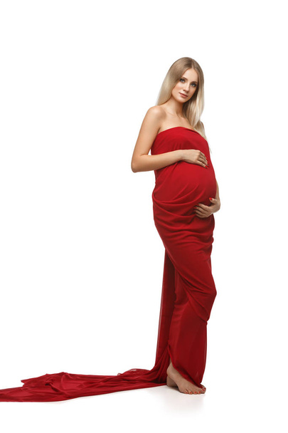 Pregnant woman in red dress - 写真・画像