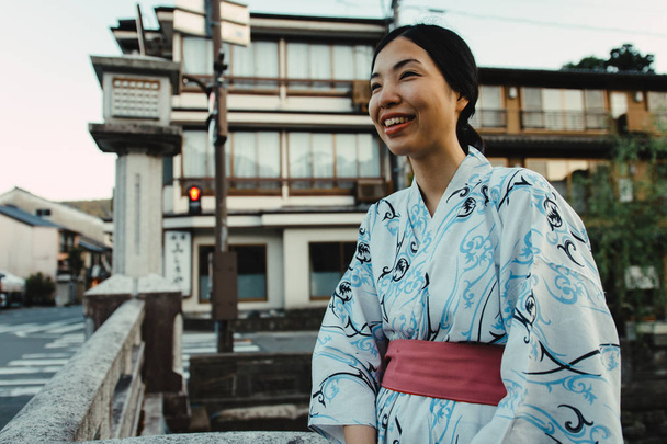 an asian girl smiling and wearing Yukata - Photo, image