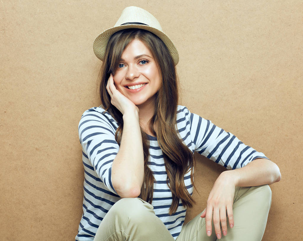 Portrait of smiling young woman wearing hat and striped shirt - Φωτογραφία, εικόνα