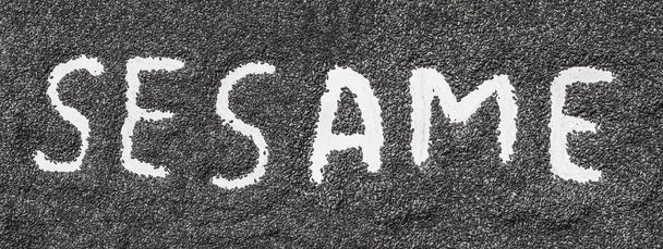 sesame word made from sesame seeds on white artist canvas. - Foto, afbeelding