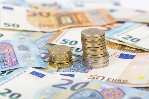 banknotes bill euro and pile of coins - Φωτογραφία, εικόνα