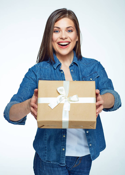 Smiling woman holding gift box. Young model . - Fotó, kép