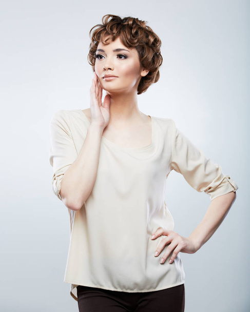 Fashion young model in beige blouse - Foto, afbeelding
