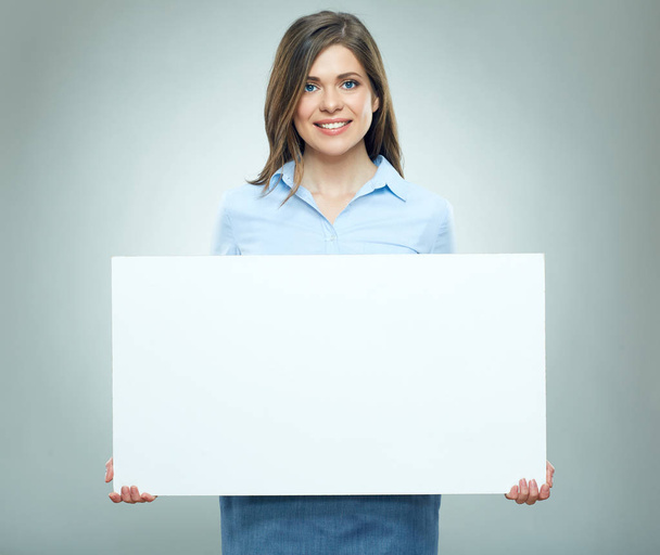 Happy young woman holding blank white  banner. - Photo, image