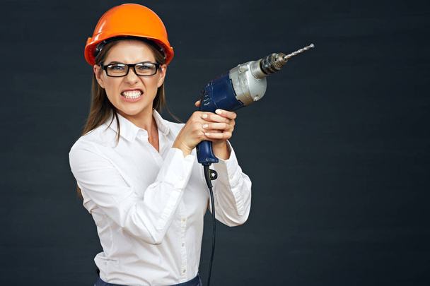 Angry business woman holding drill tool.  - Photo, Image