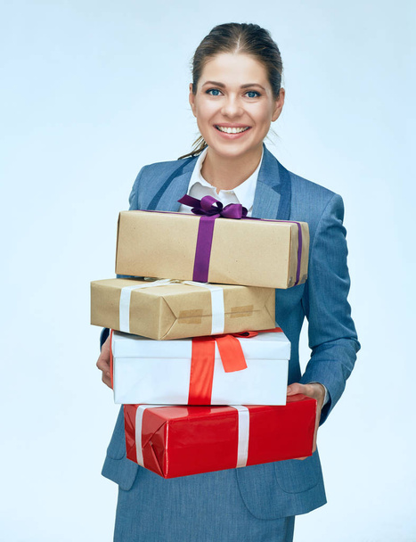 Business woman holding gift boxes. Christmas presents. Smiling g - Fotó, kép
