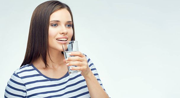 Young woman drink water from glass.  - Zdjęcie, obraz