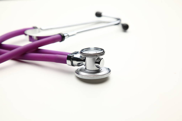 Closeup of a medical stethoscope, isolated on white background - Photo, image