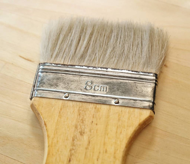 Flat Paint Brush or Decorators Brush on Table - Photo, Image
