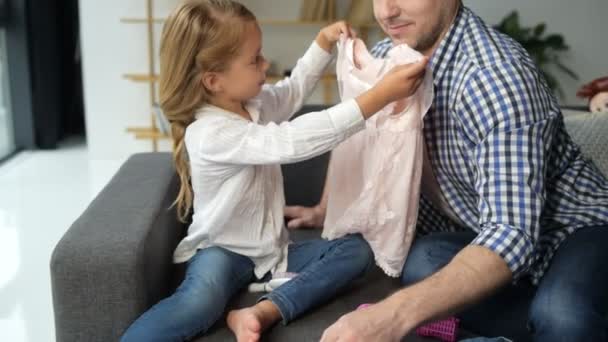 Nice little girl playing with her caring father - Séquence, vidéo
