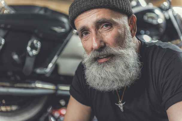 Glad old male person in garage - Valokuva, kuva