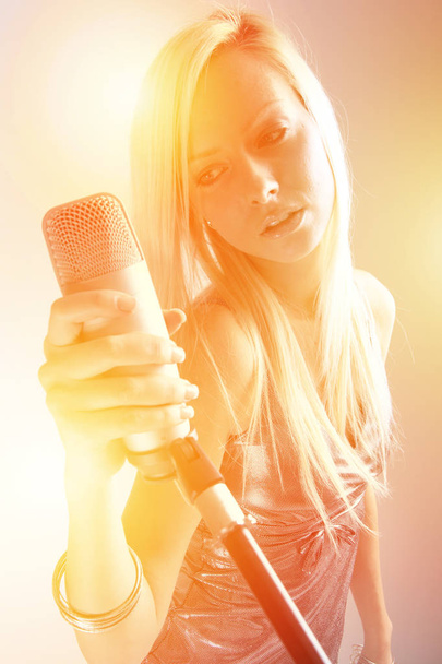 portrait of a girl with a microphone - Photo, Image