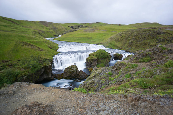 Mountain view of Skogarfoss waterfall, Iceland. - Fotó, kép