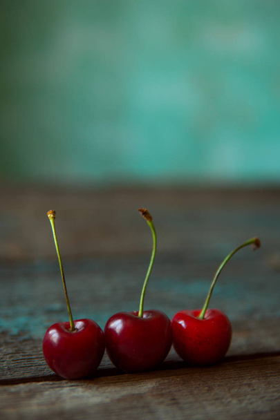 Cherry on wooden board. Tree cherries, selective focus - Foto, imagen