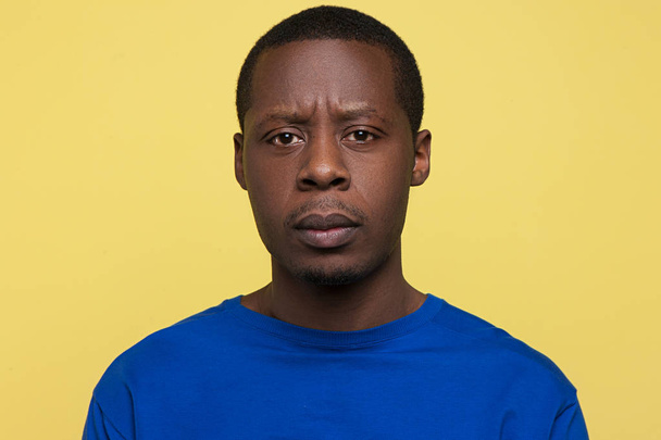 Disappointment expression. Unhappy black male - 写真・画像